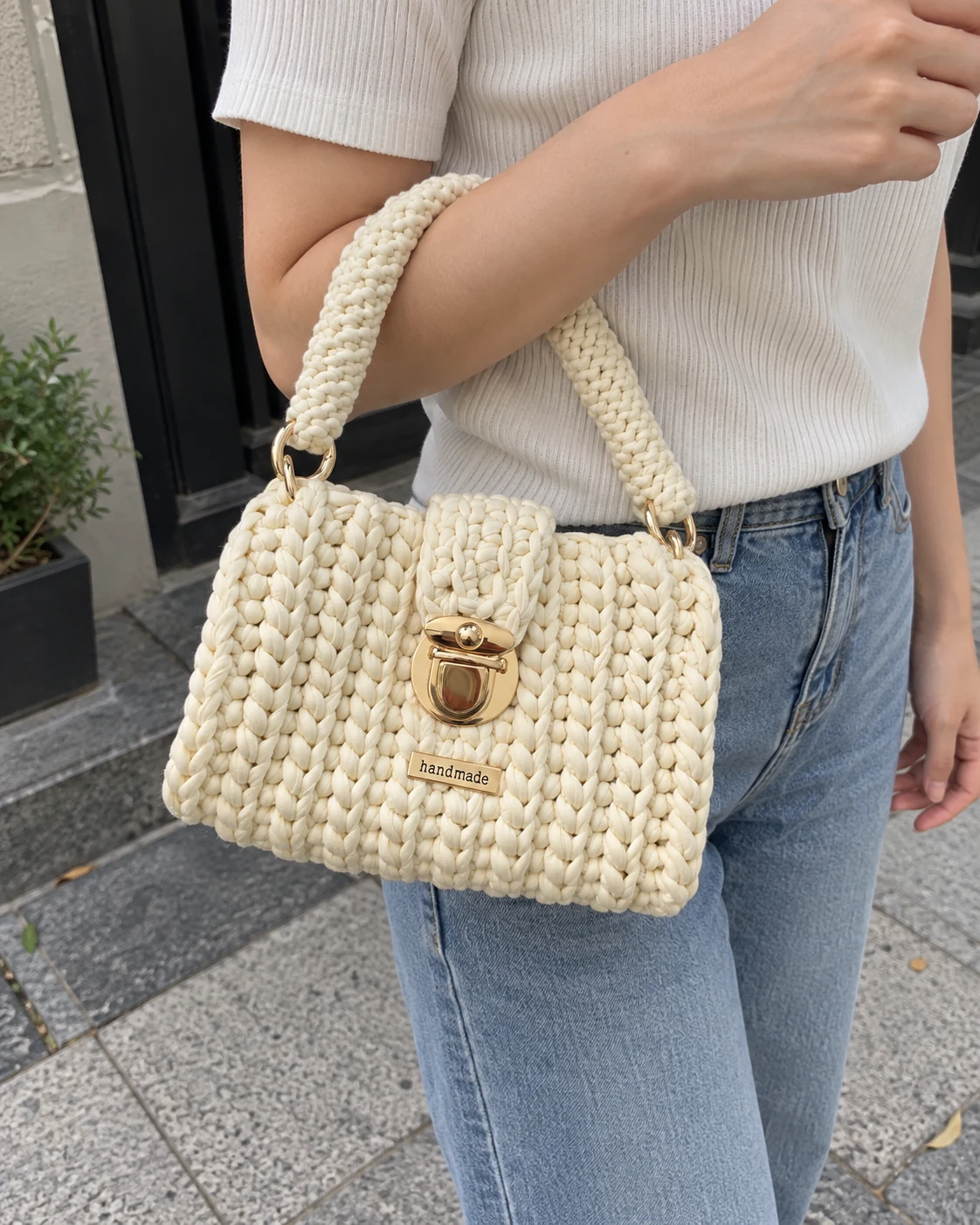 Photo of Ivory clasp handbag