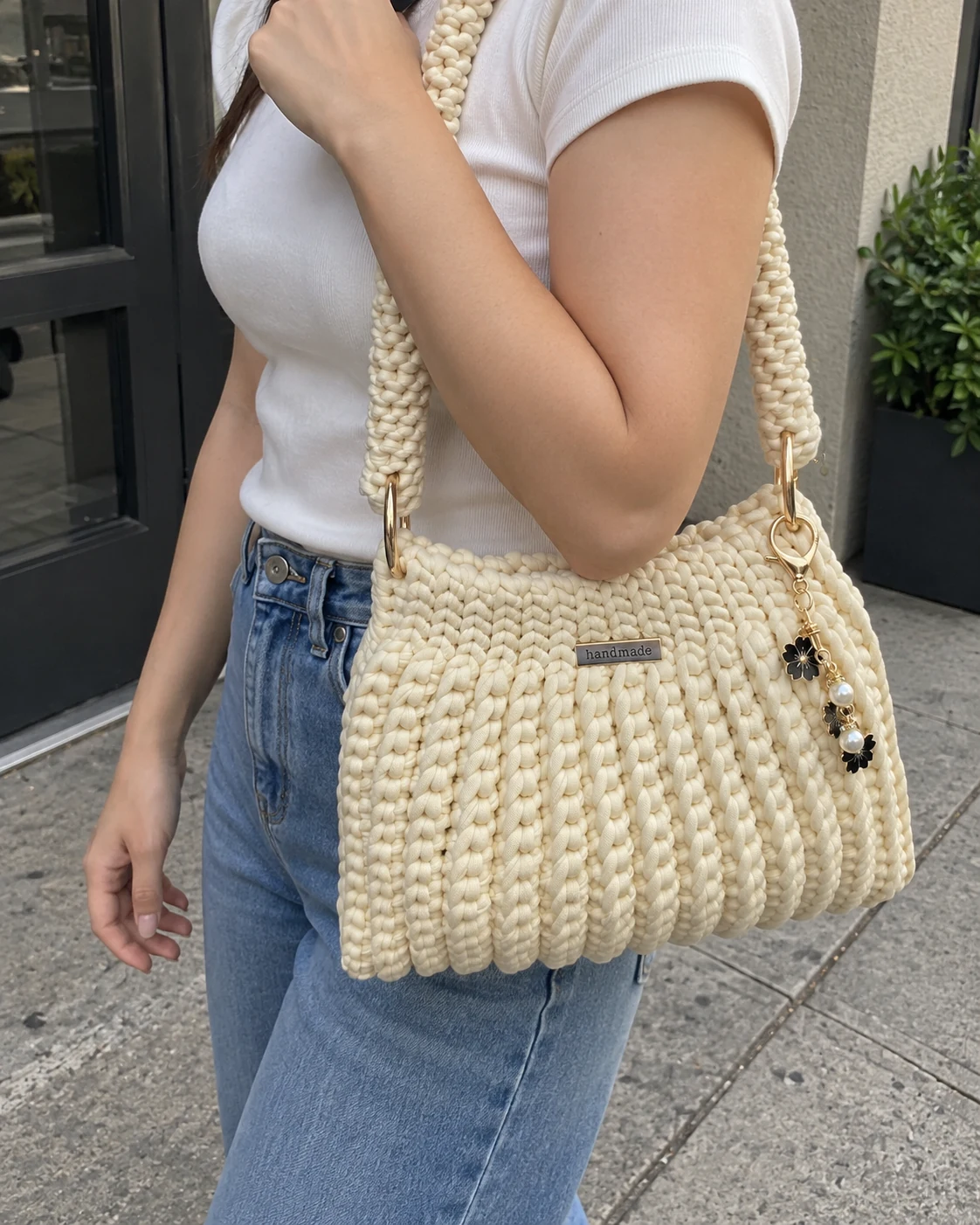 Photo of Ivory flower-charm shoulder bag